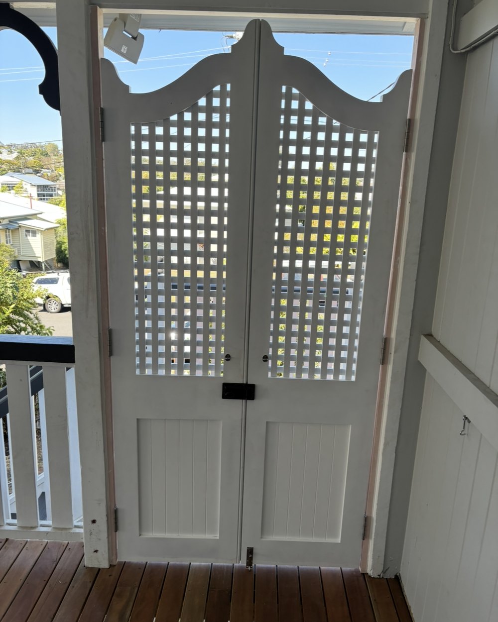 New sliding doors opening onto a hardwood deck on a Brisbane renovation
